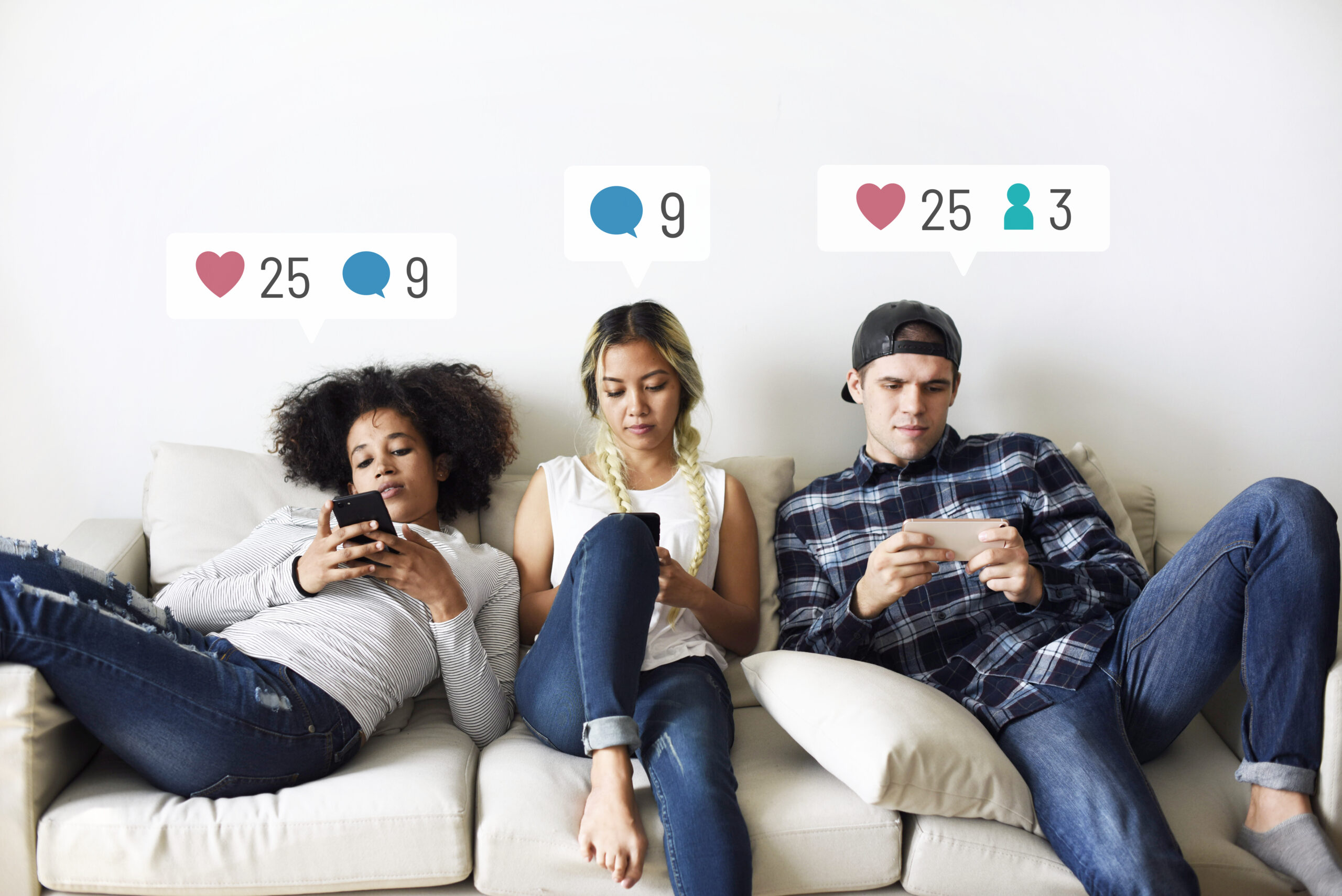 A group of friends sitting on a couch staring at their smartphones, showing how casual users interact with the instagram algorithm without trying to boost engagement.